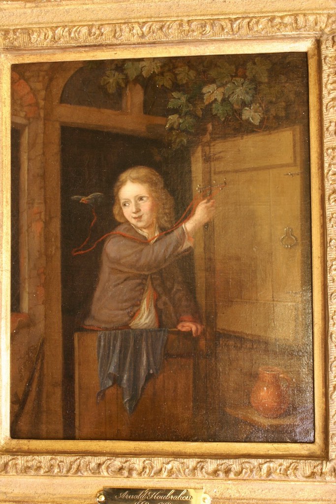 Arnold Houbraken 1660-1719 - A boy standing in a doorway holding  a finch on a string - Oil on canvas